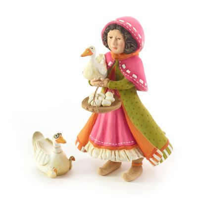 a figurine of a girl holding a basket with a goose and duck next to it