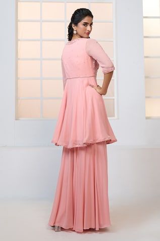 Peach peplum kurta with resham, beads and sequin floral pattern embroidery. Comes with sharara and scatter embroidered dupatta. - Aza Fashions Traditional Peplum Sharara With Floral Embroidery, Traditional Floral Embroidered Peplum Sharara, Elegant Floral Embroidered Peplum Sharara, Festive Semi-stitched Peach Sharara, Semi-stitched Peach Sharara With Intricate Embroidery, Floral Peplum, Beaded Neckline, Sharara Set, Trim Detail