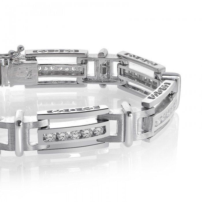 "This stunning men diamond bracelet features bracketed links with 2.75 carat (total carat weight) (G SI-2) channel set diamonds. Tongue clasp. Bracelet is 8\" and weighs 36.5 grams. Fashioned in 14K white gold. Secured with tongue clasp.For more information, contact Avital & Co Jewelry at (212) 764-6851 Payment: Payment must be received within 2 business days of the sale being completed. We are a New York based company, sales tax will be charged on all orders shipped within the state of New Luxury Diamond Bracelet For Anniversary, Luxury Tennis Bracelet With Channel Set For Formal Occasions, Luxury Channel Set Tennis Bracelet For Formal Occasions, Luxury Diamond Channel Set Tennis Bracelet, Luxury Diamond Tennis Bracelet With Channel Set, Formal Diamond Tennis Bracelet Channel Set, Luxury Channel Set Diamond Tennis Bracelet, Modern Channel Set Diamond Bracelet For Anniversary, Timeless Diamond Bracelet With Channel Set For Formal Occasions