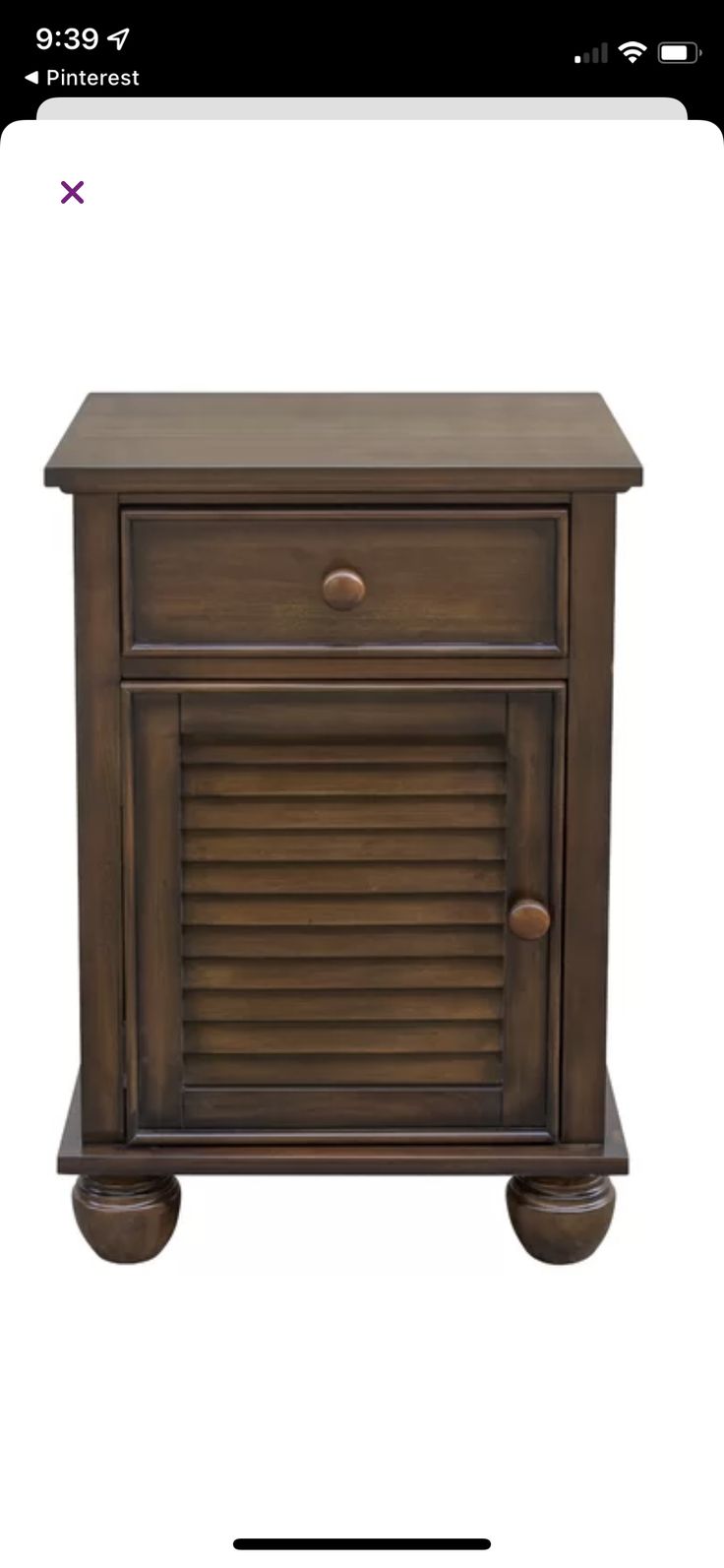 a small wooden cabinet with shutters on the front and bottom, in dark brown