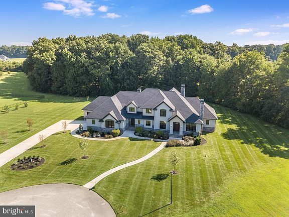 an aerial view of a large home in the country