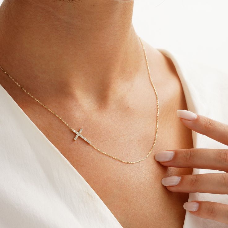 Your Sideways Cross Necklace is stylish, dainty and pretty ideal for everyday use. Details of solid gold handmade Custom Size Cross Jewelry are very eye-catching. It is a great gift for your loved ones. This jewelry will be an indispensable piece of yours. This meaningful Crucifix Jewelry with high quality handwork will be a legacy you can leave to your family its. * Details * Material / Gold Kt : This elegant necklace is made of 14k and 18k Solid Gold * Available Gold Colors : Yellow Gold, Whit Side Cross Necklace, Dainty Cross Jewelry In Cubic Zirconia, Dainty Cross-shaped Cubic Zirconia Jewelry, Dainty Cubic Zirconia Cross Jewelry, Elegant Everyday Cross Necklace With Clavicle Chain, Elegant Cross Necklace With Delicate Chain For Everyday, Delicate Clavicle Chain Jewelry With Cross Pendant, Delicate Clavicle Chain With Cross Pendant, Elegant Yellow Gold Cross Necklace