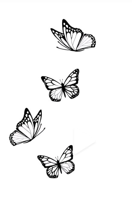 three butterflies flying in the air with one on its back and another on its side