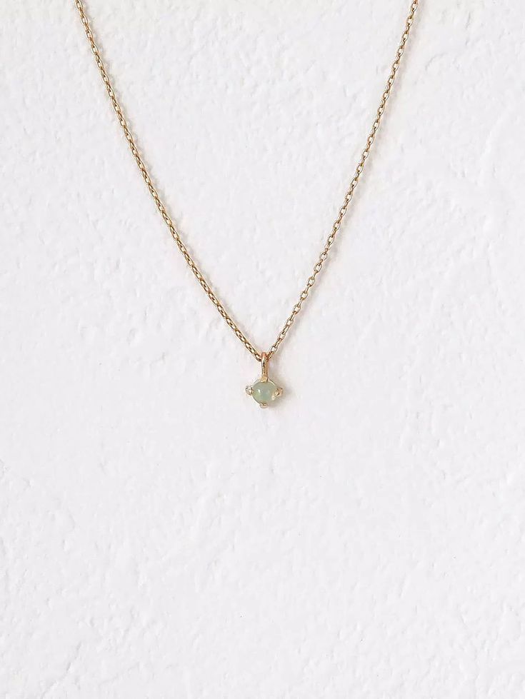 Solitaire opal on a delicate chain. Feels just like skin, dainty yet sturdy. Opal stone may appear neutral in color, but changes when reacting to different lighting like the sunlight! Made of solid 10K gold and an Ethiopian opal. Opal size: 3 mm. 0.85mm signature fine delicate chain. Chain length: 16” (40cm). Dainty Ethiopian Opal Jewelry, Minimalist Yellow Gold Opal Jewelry, Dainty Tiny Opal Jewelry, Tiny Dainty Opal Jewelry, Gold Ethiopian Opal Minimalist Jewelry, Dainty Ethiopian Opal Birthstone Jewelry, Delicate Solitaire Gemstone Necklace, Dainty 14k Gold Solitaire Gemstone Necklace, Delicate Chain