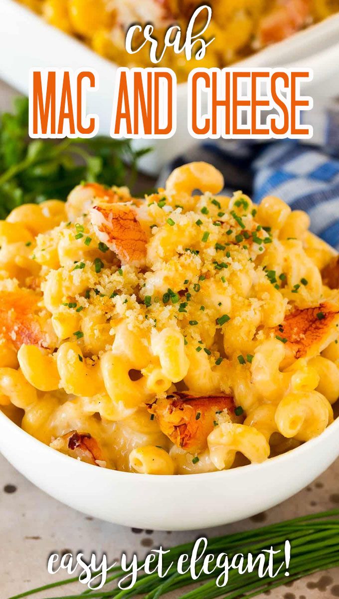 two bowls filled with macaroni and cheese on top of a table next to green onions