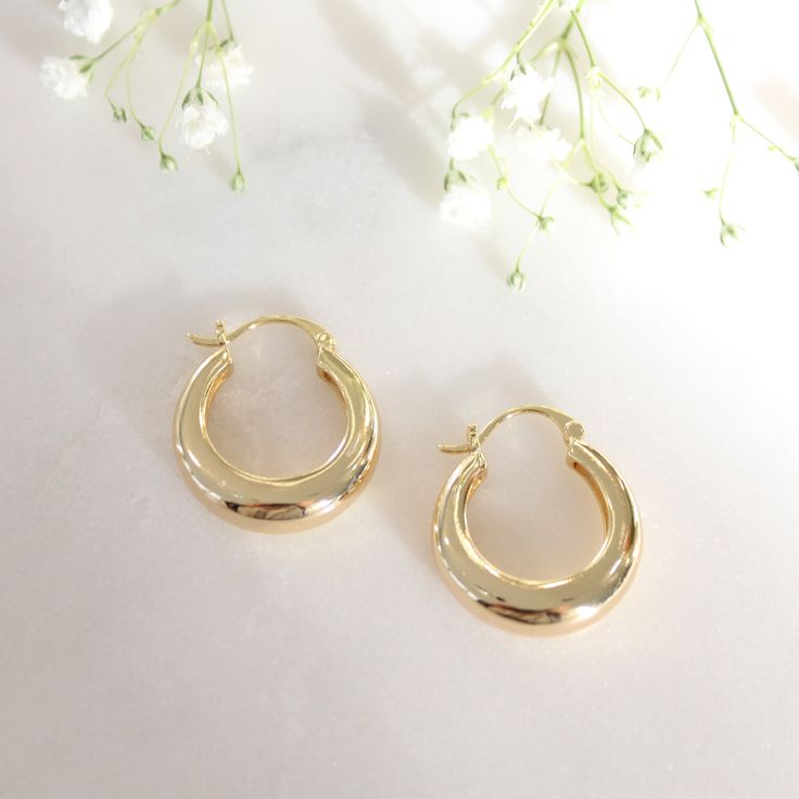 Mia 24mm Dome Earrings boast a classic design with a subtle 24mm diameter--the perfect addition to any outfit. Crafted from high-quality Jewelers brass and accented with a thick 18k gold finish, these earrings are a must have for your everyday style. Enjoy all-day comfort with a secure and lightweight clasp.   * 18k Gold Filled   * 24mm Diameter   * Nickle, Lead and Cadmium Free   * Earrings are Final Sale Timeless Oval Earrings For Everyday, Timeless Oval Everyday Earrings, Classic Oval Earrings For Everyday, Classic Gold Plated Nickel-free Huggie Earrings, Classic Nickel-free Huggie Earrings, Classic Oval Earrings, Tarnish Resistant, Classic Oval Tarnish Resistant Earrings, Classic Oval Tarnish-resistant Earrings, Nickel-free Classic Hoop Earrings For Formal Occasions