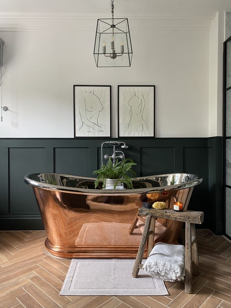 an old fashioned copper bathtub in a bathroom