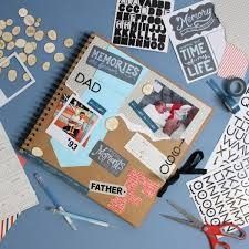 a scrapbook with pictures and scissors on top of it next to some other items