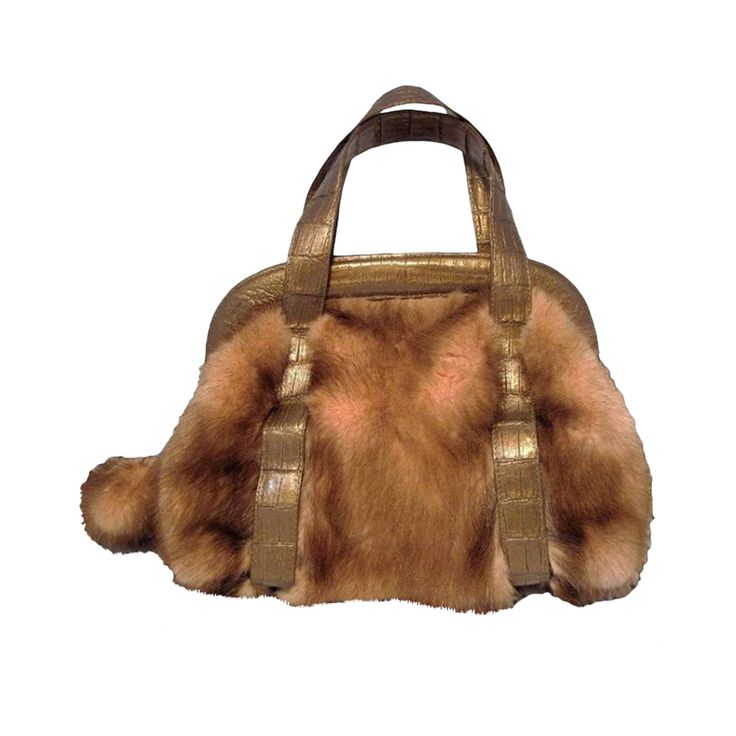 This fabulously stylish Nancy Gonzalez handbag is in pristine condition. The exterior features beautiful pink mink fur trimmed with bronze crocodile leather. The full zipper closure opens to a light beige suede interior that holds one side zippered pocket and one cell phone pocket. This beautiful piece is truly one-of-a-kind and super stylish for the cold winter months. You will not find this creation at a better price anywhere. Purchase includes a dust cover. Measurements: 12''x8''x6'' 4.5’’ handle drop Nancy Gonzalez Handbags, Crocodile Handbags, Nancy Gonzalez, Fur Bag, Brown Leather Totes, Brown Handbag, Pink Purse, Vintage Purses, Crocodile Leather