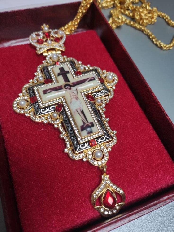 Orthodox pectoral cross, red stones cross for priest, brass chrest cross, pendant crucifix with golden Jesus, necklace religious gift idea Made of high-quality brass.  Decorated with red stones and pearls. Good gift idea for priests. Standard delivery abroad takes 2-3 weeks. So if You need a product from our shop as a gift for a special event, please, be ready that the whole process will take a few weeks. We can add the gift card to the order. Red Crucifix Cross Necklace Gift, Red Crucifix Cross Necklace For Gift, Red Cross Pendant Necklace For Gift, Red Cross Pendant Necklace Gift, Handmade Red Crucifix Jewelry, Cross Necklace With Large Pendant As A Gift, Large Pendant Cross Necklace As Gift, Large Pendant Cross Necklace For Gift, Gift Cross Necklace With Large Pendant