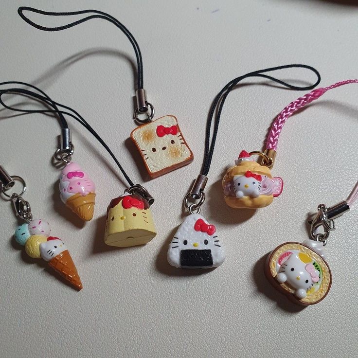 six different kinds of hello kitty charms on a table