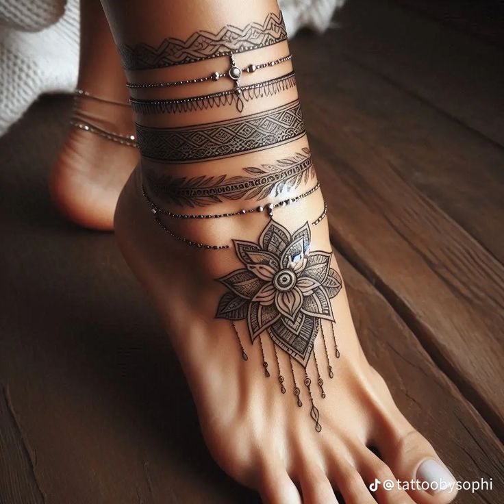 a woman's foot with tattoos and bracelets on her ankles, sitting on a wooden floor