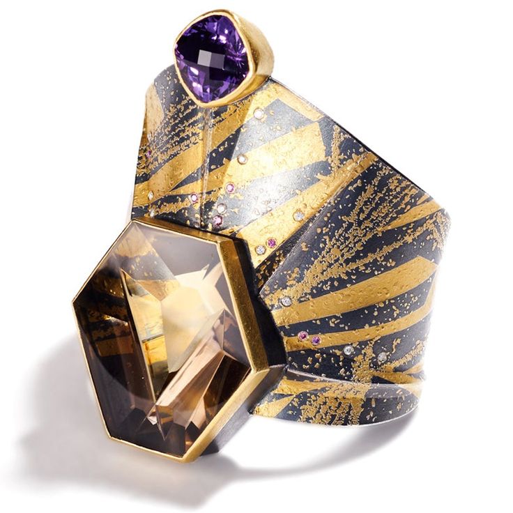 24K & 22K yellow gold, oxidized sterling silver, Munsteiner cut smoky quartz 80.66cts, bezel-set rose cute amethyst 13.53cts, faceted fancy diamonds 0.11cts, faceted white VS1 diamonds 0.16 total carat weight • 3.15" (8cm) width and tapers down to 1" (2.54cm) • 2.5" (6.3cm) inside diameter • 1" (2.54cm) band opening • One of a kind Unique Multi-stone Gold Amethyst Ring, Unique Gold Multi-stone Amethyst Ring, Luxury Gold Amethyst Ring With Rose Cut Diamonds, Luxury Gold Amethyst Ring Gift, Luxury Amethyst Ring With Rose Cut Diamonds For Gift, Vs1 Diamond, Book Jewelry, Fancy Diamonds, Pendant Rings