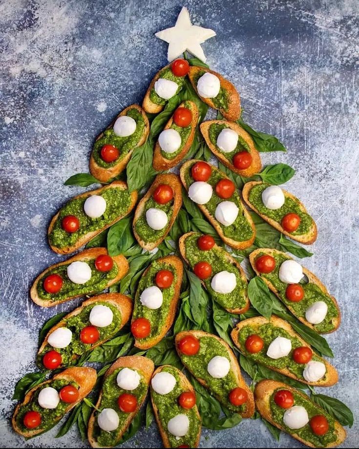 a christmas tree shaped appetizer made out of crackers