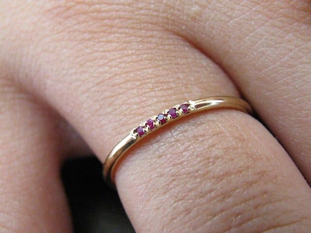 Ruby Wedding Band Solid Gold 14k Jewelry, Eternity Band Ruby, Half Eternity Ring, Ruby Stacking Ring, Wedding Ring Ruby FREE SHIPPING Solid Gold Gold KT: solid gold 14k Gold color: White gold, rose gold, yellow gold Available in solid gold 18kt Stones Ruby shape: Round Ruby size: 5x1mm Total weight: 0.03ct Number Stones: 5 Width of band: 1.30 mm SIZING From 3US to 9US For other size, please contact me CUSTOM & PERSONALIZED ORDERS If you have an idea, we make personalized orders Contact us GI Wedding Stackable Ruby Rings In Gold, Wedding Ruby Eternity Band In Yellow Gold, Classic Ruby Eternity Band For Wedding, Wedding Yellow Gold Ruby Eternity Band, Gold Stackable Ruby Ring For Wedding, Gold Ruby Stackable Ring For Wedding, Ruby Eternity Band With Prong Setting For Wedding, Wedding Ruby Eternity Band In Fine Jewelry Style, Ruby Eternity Band For Wedding