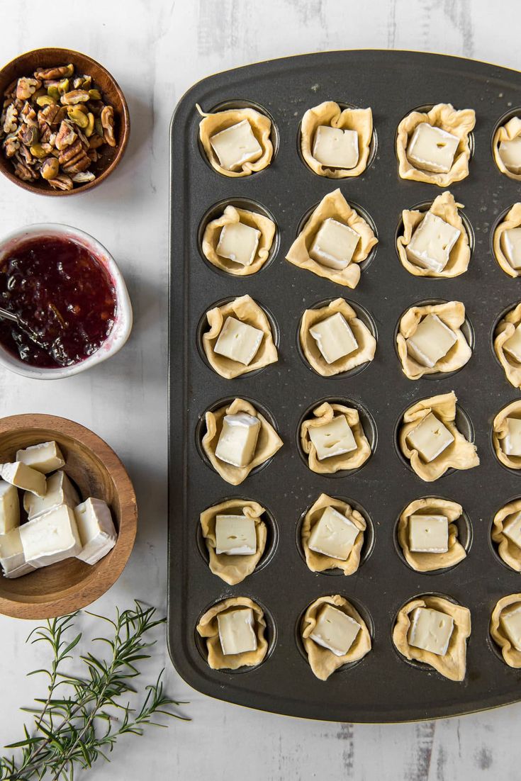 some food is sitting on top of a baking pan and ready to be cooked in the oven