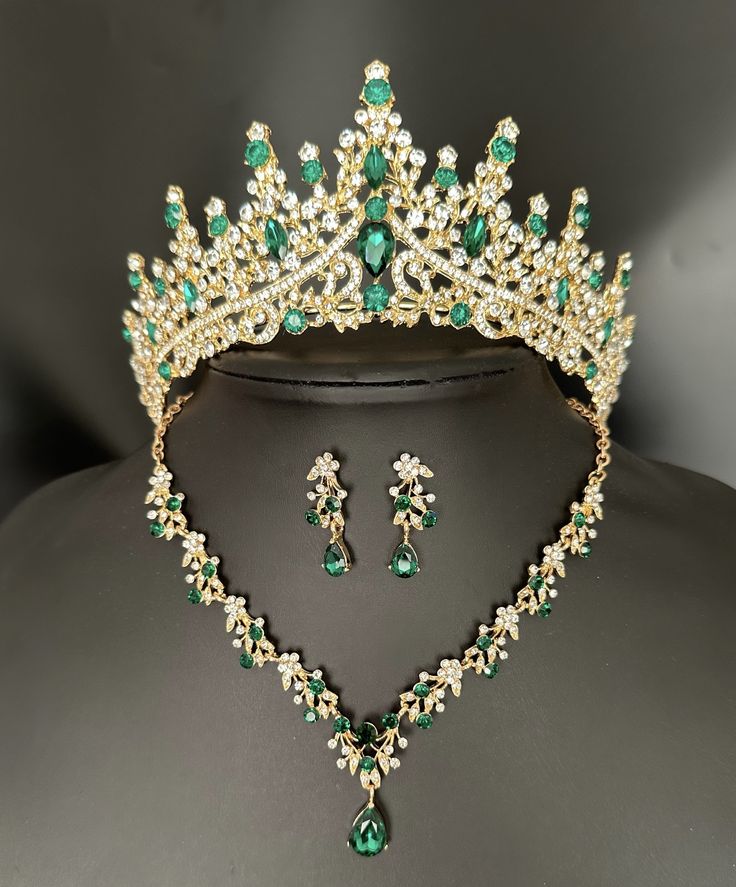 a green and white tiara with matching earrings