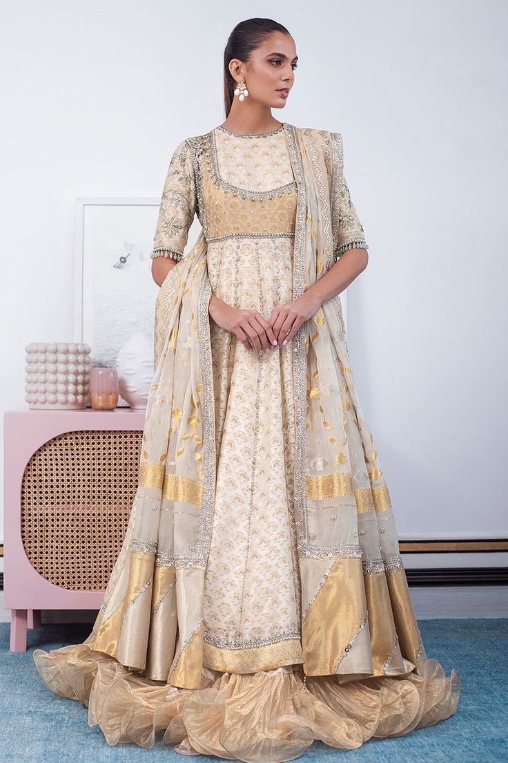 Nilofer – Sania Maskatiya International Gold Anarkali Set, Dola Silk Cutdana Kurta For Reception, Gold Anarkali Salwar Kameez, Reception Cutdana Dola Silk Kurta, Reception Dola Silk Kurta With Cutdana, Raw Silk Anarkali Set For Reception And Diwali, Anarkali Tissue Silk Traditional Designer Wear, Eid Anarkali Choli With Zari Work, Anarkali Kurta With Gold Embroidery For Transitional Season