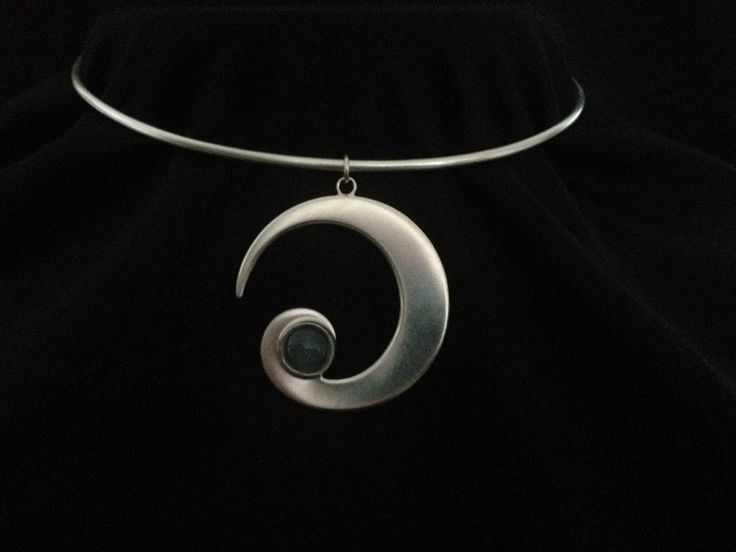 Crescent Moon Torc is made from Sterling silver (925) and hallmarked by The Goldsmiths` Company, London Assay office. Every Moonstone is carefully selected for its beauty and luminous qualities. Laluna  is a unique silvercraft that alchemically combines the power of metals and gemstones, to forge symbolic jewellery. Inspiration for this collection is drawn from ancient ritual, magick, and the moon. Each piece has been designed and handcrafted in harmony with the lunar phases and her energy. Lalu Formal Moon Phase Sterling Silver Jewelry, Elegant Silver Jewelry With Sun And Moon Design, Elegant Silver Sun And Moon Design Jewelry, Modern Silver Spiral Jewelry, Formal Silver Jewelry With Moon Charm, Silver Jewelry With Moon Charm For Formal Occasions, Modern Round Collectible Jewelry, Modern Metal Crescent Jewelry, Modern Crescent Metal Jewelry