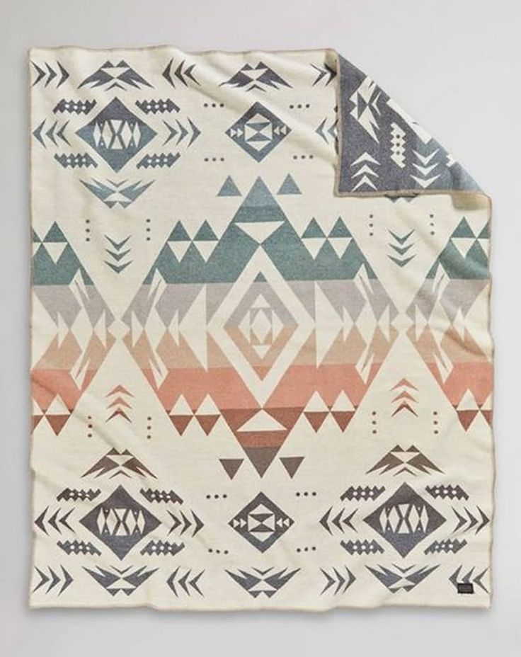 a blanket with an abstract design on it