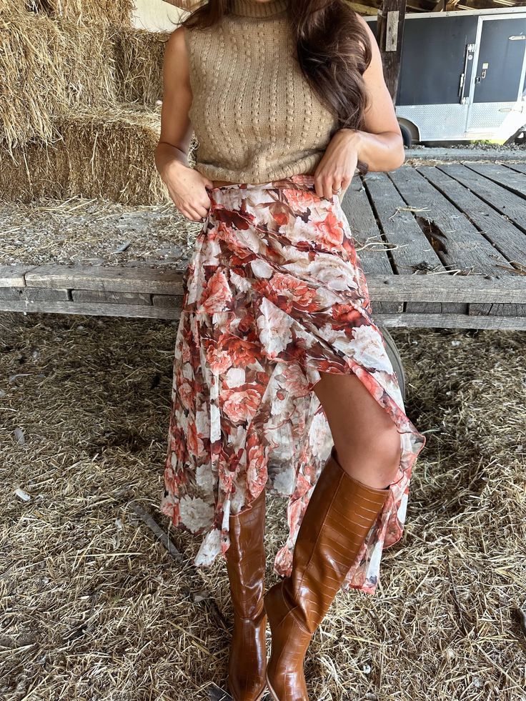 The Rustic Romance Skirt features a lined design, elastic waistband, and delicate floral print. The ruffle detail adds a touch of femininity to this versatile and comfortable skirt. Perfect for any occasion, it is a must-have addition to your wardrobe. Fabric 100% polyester Fall Floral Print Tiered Skirt, Tiered Floral Print Skirt For Fall, Floral Print Tiered Skirt For Fall, Brown Asymmetrical Maxi Skirt For Spring, Brown Tiered Skirt For Spring, Spring Brown Tiered Skirt, Chic Skirted Bottoms With Floral Print, Flowy Floral Print Skirt For Fall, Beige Floral Print Skirt For Day Out