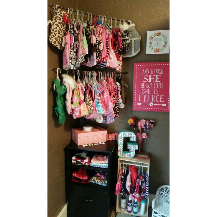 the closet is full of baby clothes and shoes for girls to wear on their own