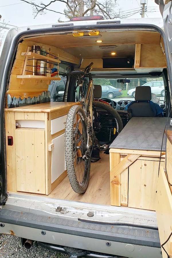 the back end of a van with a bike in it