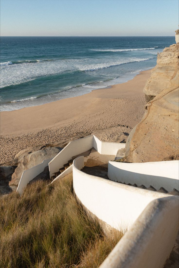 Sharp, spiraling white staircase leading down to a wide and empty beach along Portugal's beautiful Silver Coast in the middle of winter. Beach House Portugal, Silver Coast Portugal, Portugal Beach House, House In Portugal, Portugal In Winter, Dream Roadtrip, Portugal Coast, Portugal Winter, Portugal Beaches