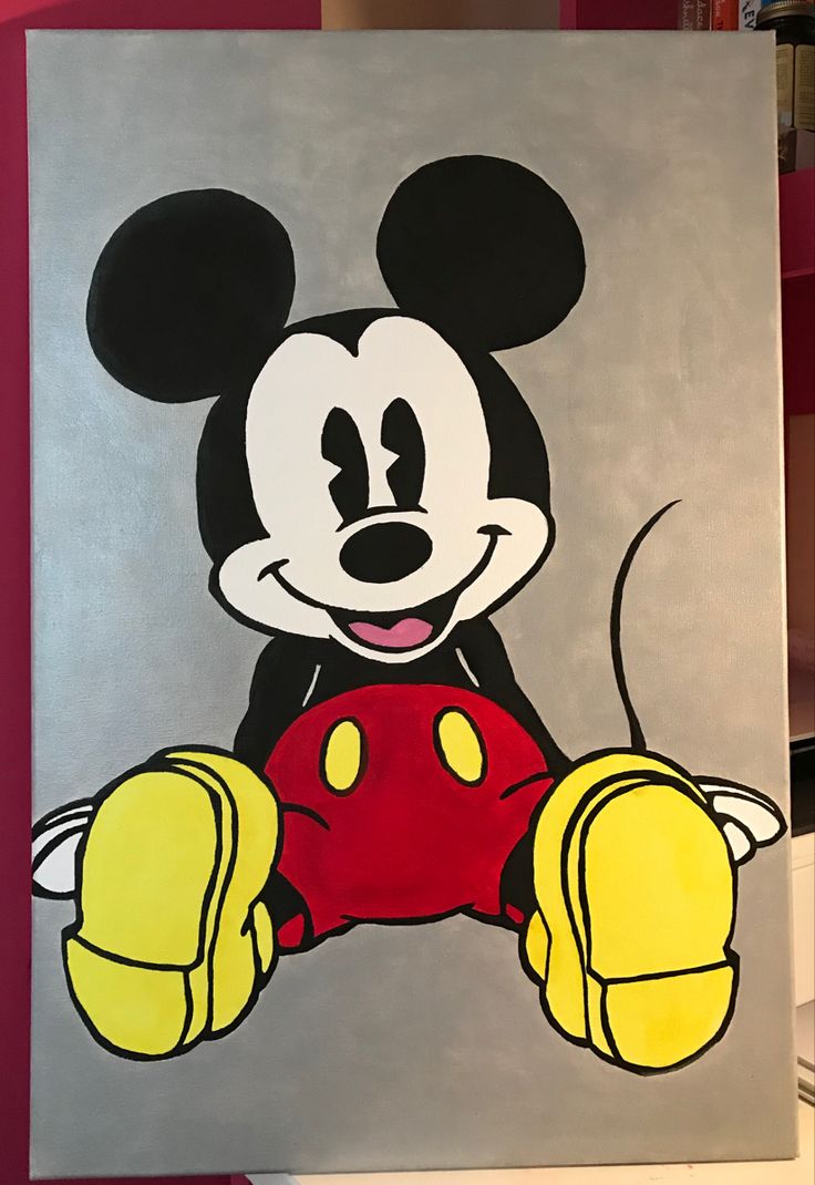 a painting of mickey mouse sitting on top of a white board with red and yellow paint