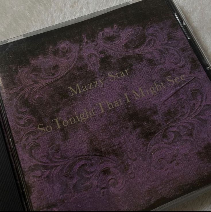 a purple book sitting on top of a white table