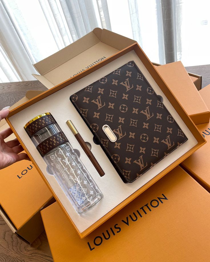 the louis vuitton case is open and it's contents are in its box