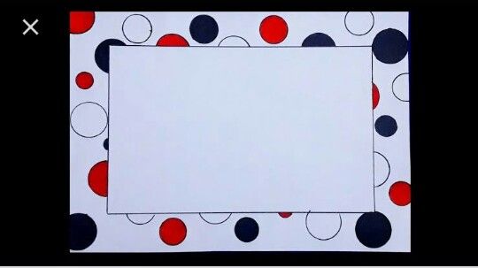 a white square with red, black and blue dots on it is surrounded by smaller circles