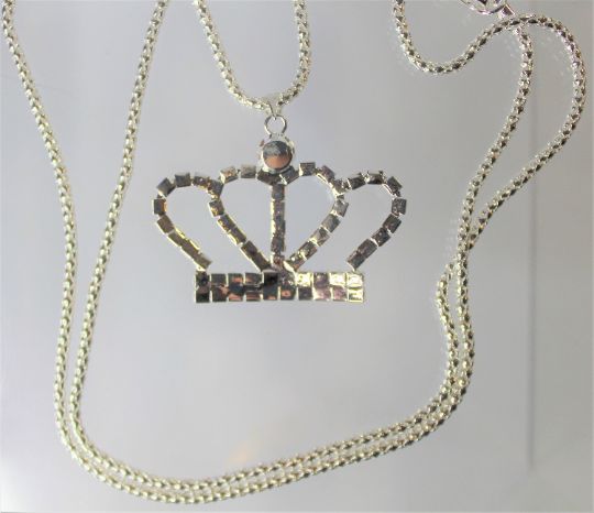 Gold or Silver Jewel Encrusted Crown Pendant, These crown necklaces are perfect for all royalty with all their rhinestones. They would make an exceptional gift for a fashionista. They are exquisite and would make an excellent charm or just as a collectible for the designer at heart. The are about 1.5 in x 2 in and they come with a 28" chain. Party Pendant Rhinestone Necklace With Bling, Party Rhinestone Pendant Necklace With Bling, Rhinestone Pendant Necklace For Parties, Metal Rhinestone Pendant Necklace For Parties, Party Rhinestone Pendant Necklace, Metal Rhinestone Pendant Necklace, Rhinestone Metal Chain Necklace Gift, Metal Rhinestone Necklace For Gift, Metal Necklace With Rhinestones For Gifts