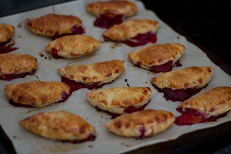 there are many pastries on the baking sheet