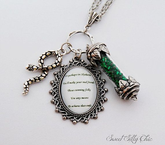 a necklace with a bottle and charms attached to it