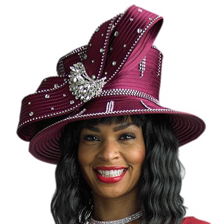 Introducing the exquisite Lily And Taylor H917-BUR Church Hat, a statement piece that speaks volumes in elegance and style. Meticulously crafted from premium materials, this church hat boasts a rich Bordeaux color that exudes a sense of regal sophistication. The design is highlighted by the striking asymmetrical brim that adds an edge of modern fashion to a classic silhouette. Adorning this beautiful hat are shimmering rhinestone embellishments, carefully placed to catch the light and draw the eye. These sparkling details serve not only as a luxurious accent but also as a testament to the impeccable attention to detail that goes into each Lily And Taylor creation. With every turn of the head, the hat dazzles and shines, ensuring that you'll stand out in any congregation or social gathering Luxury Formal Hat With Structured Crown, Luxury Formal Hats With Structured Crown, Classic Evening Hat With Structured Crown, Luxury Flat Brim Hat For Evening, Luxury Flat Brim Evening Hat, Luxury Hat With Short Brim For Royal Ascot, Luxury Short Brim Hat For Royal Ascot, Elegant Church Costume Hat With Structured Crown, Elegant Structured Crown Costume Hats And Headpieces For Church