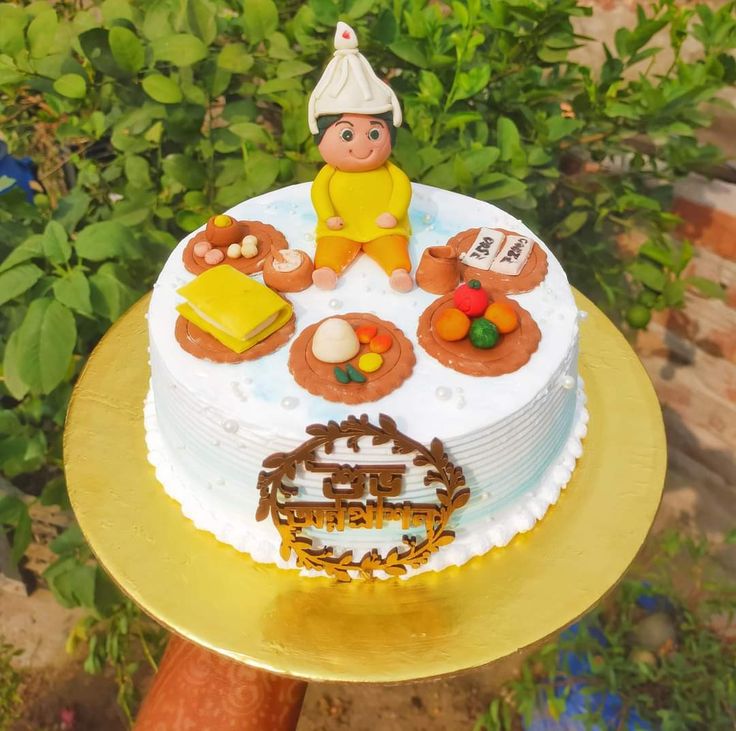 a white cake topped with lots of different types of food