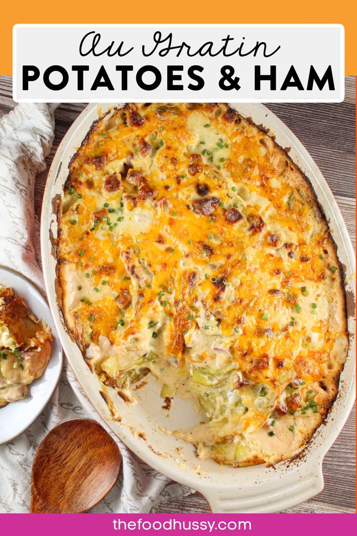 a casserole dish with potatoes and ham in the middle on a wooden table