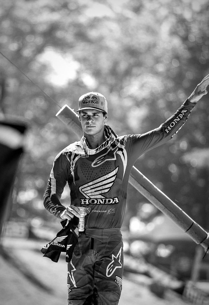 a man holding skis and poles in his hands