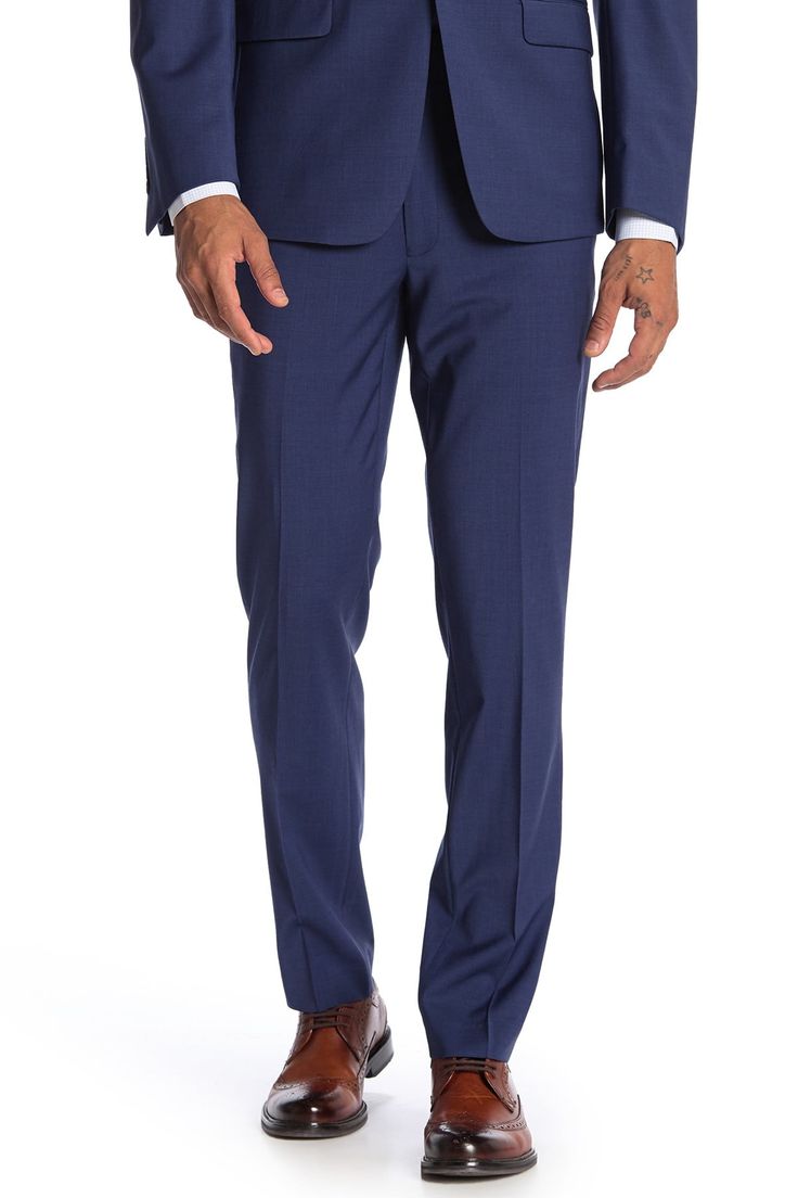 A signature pair of wool twill pants cut in a skinny fit are perfect for a polished and professional look at the office. Fit: this style fits true to size. Skinny fit. Zip fly with button and hook-and-bar closure. Side slash pockets. Back besom pockets. Wool blend construction. Approx. 10.5" rise, 32" inseam (size 32x32). Imported Modern Fitted Calvin Klein Bottoms, Fitted Calvin Klein Suits For Workwear, Calvin Klein Fitted Suit For Work, Fitted Calvin Klein Suit For Work, Elegant Tailored Calvin Klein Bottoms, Elegant Tailored Bottoms By Calvin Klein, Calvin Klein Fitted Business Suit, Fitted Calvin Klein Business Suits, Elegant Calvin Klein Straight Dress Pants