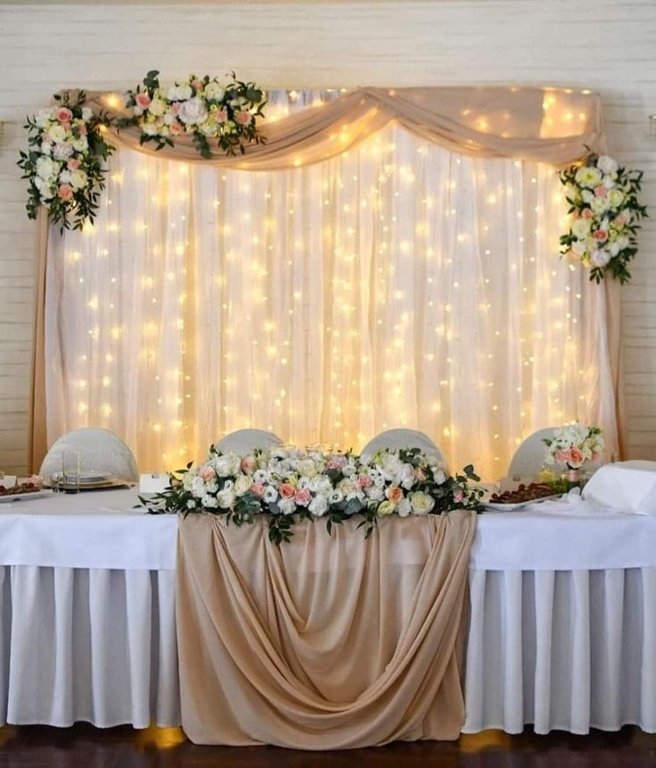 a table with flowers and lights on it