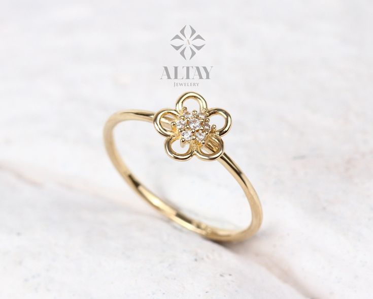 ABOUT PRODUCT This 14K Gold Flower Ring is suitable gift for girlfriend, mom and her. You can even buy as a birthday gift for your friends or anniversary gifts, If you want to add a special note we can write for you and put to inside of package. We manufacture our jewelry pieces with carefully and after production we double checking in quality control department. Our main idea is keep our items for daily wearing especially for minimalist jewelry pieces. 14K Gold Flower Ring, Diamond Daisy Ring, Luxury Flower Shaped Diamond Ring Gift, Luxury Flower Shaped Rings As A Gift, Luxury 14k Gold Flower Ring Gift, Elegant Mother's Day Flower Ring, Flower Shaped Ring For Wedding And Mother's Day, Luxury Flower Ring With Halo Setting For Gift, Luxury Flower Ring As Gift, White Gold Flower Diamond Ring For Gift, Fine Jewelry Diamond Flower Ring As Gift