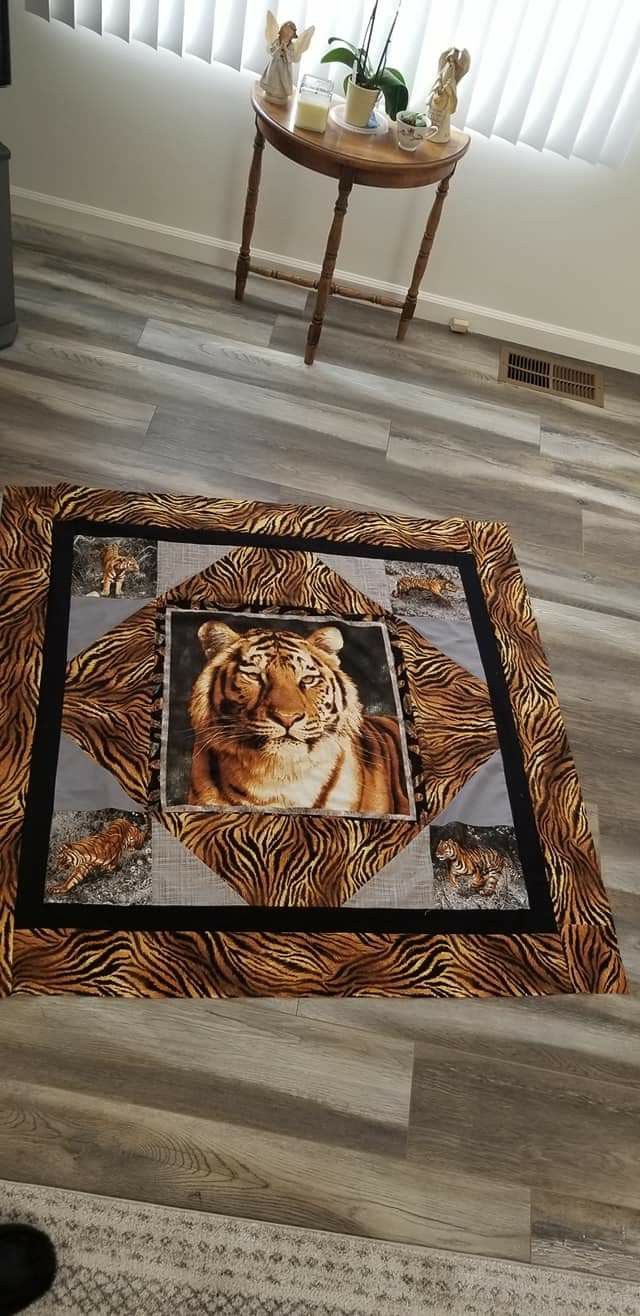 a tiger rug on the floor in a living room