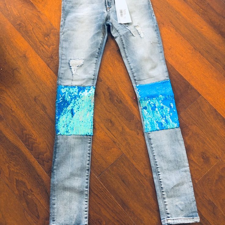 Manila Grace Distressed Denim Stretch Jeans With Blue Opal Embellished Sequin Knee. Great Way To Elevate Your Denim Luck Flattering Jeans New With Tags True To Size. Straight Leg Denim Bottoms With Sequins, Straight Leg Denim Sequined Bottoms, Embellished High Rise Denim Jeans, High Rise Embellished Denim Jeans, Sequined Straight Leg Denim Bottoms, Embellished Fitted Dark Wash Jeans, Ripped Fitted Jeans In Recycled Denim, Fitted Ripped Jeans In Recycled Denim, Straight Leg Denim Jeans With Sequins