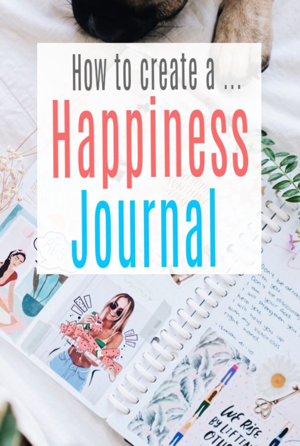 a dog laying on top of a bed next to an open notebook with the title how to create a happiness journal