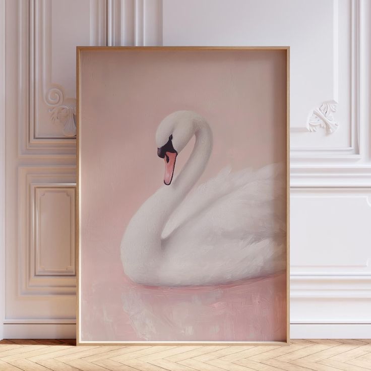 a white swan is sitting in front of a pink background with an ornate gold frame