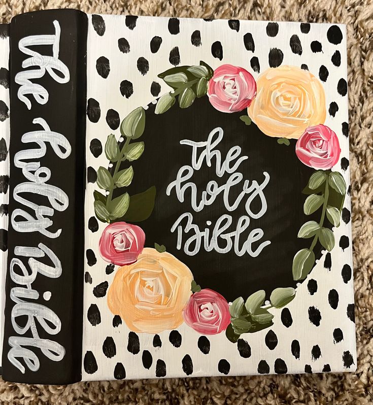 the book is decorated with flowers and polka dots