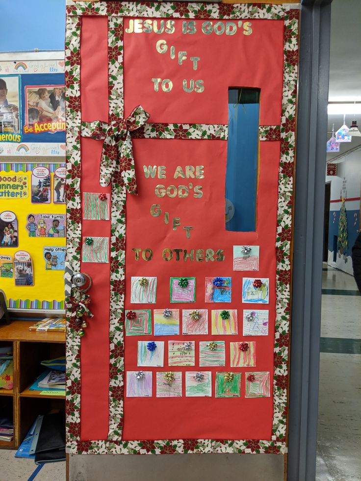 a bulletin board with pictures and words on it in the middle of a classroom room