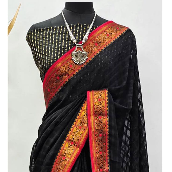 Black colored saree is made from art silk fabric which is highlighted with beautiful weaving work as shown. comes along with unstitched jacquard blouse which you can customise as per your design/style. Occasion - You can wear this saree for festive, functions and ideal for any fashionista. Note:- the actual product may differ slightly in color and design from the one illustrated in the images when compared with computer or mobile screen. Festive Black Pre-draped Saree With Self Design, Black Cotton Silk Traditional Wear For Navratri, Navratri Black Cotton Silk Traditional Wear, Black Cotton Silk Pre-draped Saree With Zari Work, Black Art Silk Pre-draped Saree With Zari Weaving, Black Tussar Silk Saree With Self Design, Black Pre-draped Saree With Zari Weaving For Puja, Black Art Silk Saree With Pallu, Semi-stitched Black Art Silk Blouse Piece