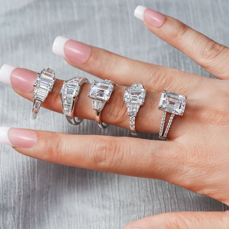 A classic cocktail ring that is similar to a famous singer's ring - BLACKPINK - Lisa. This Lisa ring features a sparkling emerald cut cubic zirconia as the center stone, along with 6 baguette cuts stone tapered to the band on both sides. The stones work together to reflect light and offer an exquisite and iridescent look to the your hand. With polished sterling silver adding to the glow, this Lisa ring is beautiful and is an ideal gift for special occasions. DESIGN Prong-set emerald-cut Cubic Zi Emerald Eternity Band, Engagement Ring Band, Emerald Cut Ring, Split Shank Ring, Emerald Cut Rings, Dream Engagement, Leverback Earrings, Band Engagement Ring, Stone Work